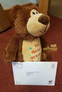 Tag the bear, from Supported Holidays, takes a trip to the post office